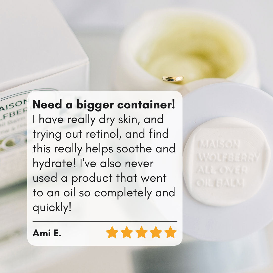 5/5 customer review with All-Over Oil Balm moisturizer in the background with a small golden spoon