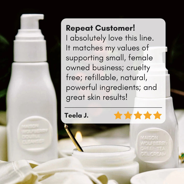 5/5 customer review of skincare set with skincare bottles and candle in the background